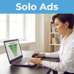 A female marketer looking at an email funnel chart on a laptop in a home office.