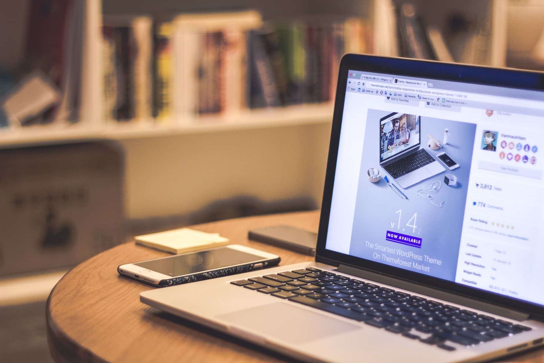 Best WordPress Themes for Affiliate Blogs in 2026 5 A laptop and phone set up at a clean workspace for building a content website